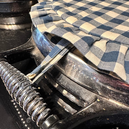 Close-up of a checkered fabric AGA chefs pad on an AGA handle